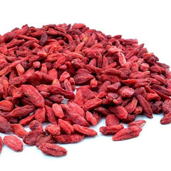 Pile of red goji berries on a white background