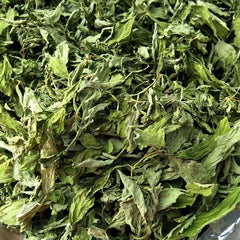Dry green leaves in a clear plastic bag
