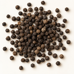 Whole black peppercorns, top-down product image