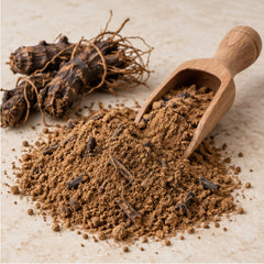 Molineria latifolia powder with wooden scoop and botanical material