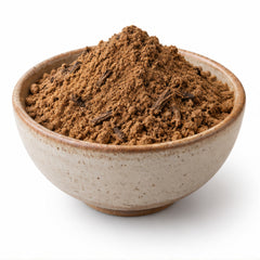 Molineria latifolia powder in a ceramic bowl