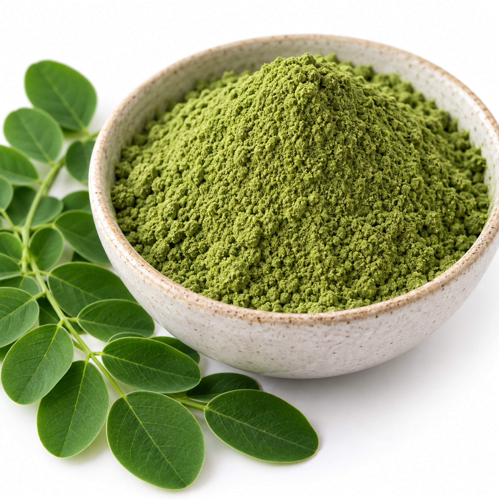 Close-up of Moringa oleifera leaf powder and leaves