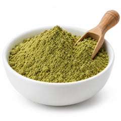 Senna garrettiana leaf powder in a white bowl
