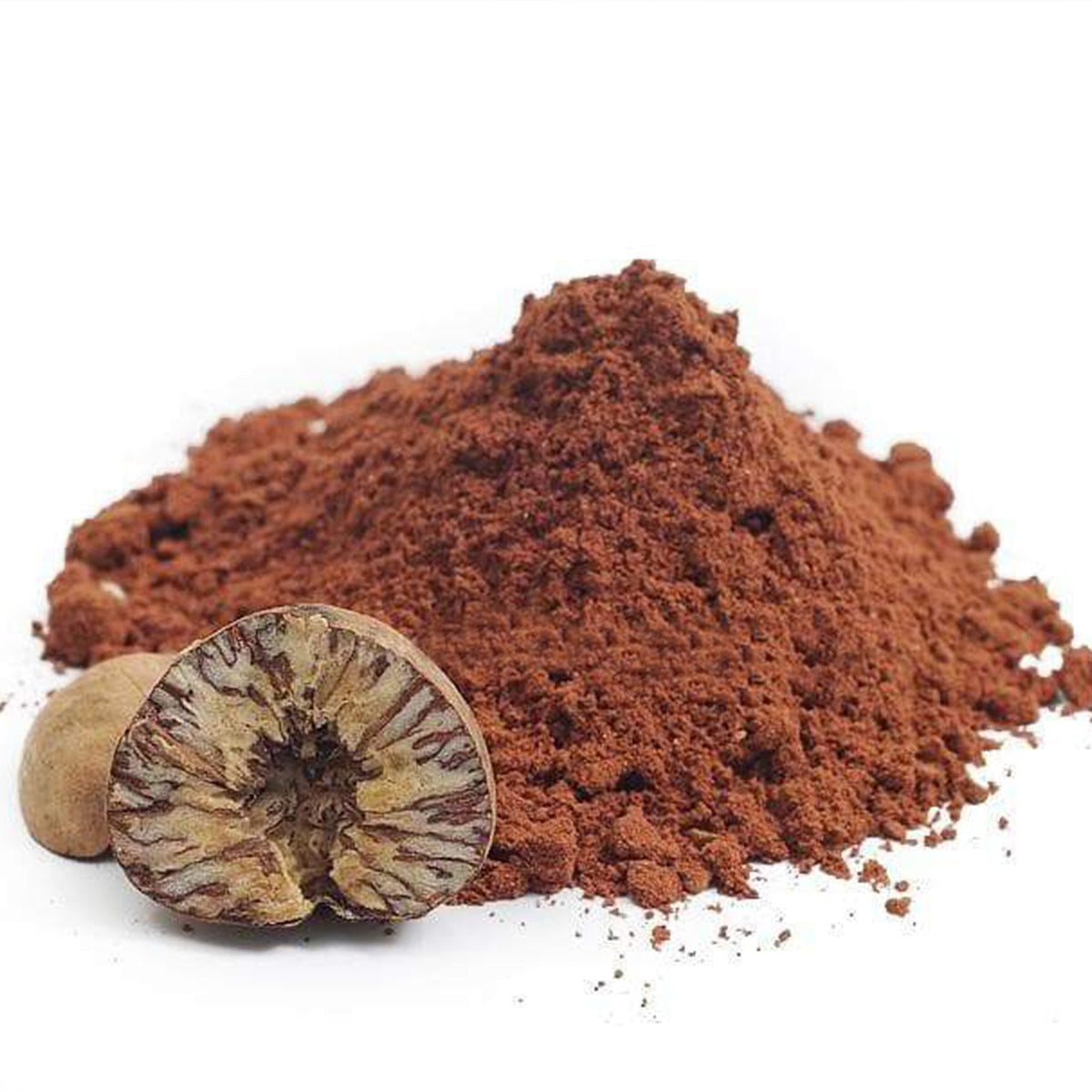 Pile of red powder with a split nutmeg on a white background